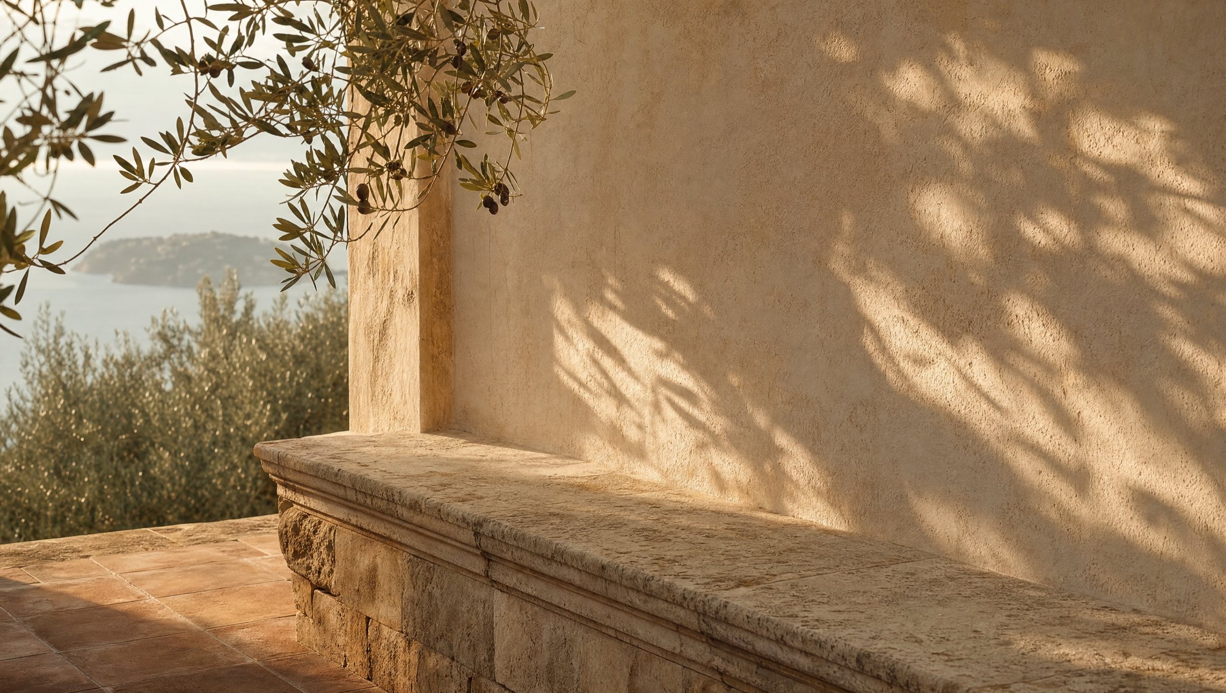 a table set high on a sicilian terrace overlooking the sea in afternoon light, olive branches and warm stone