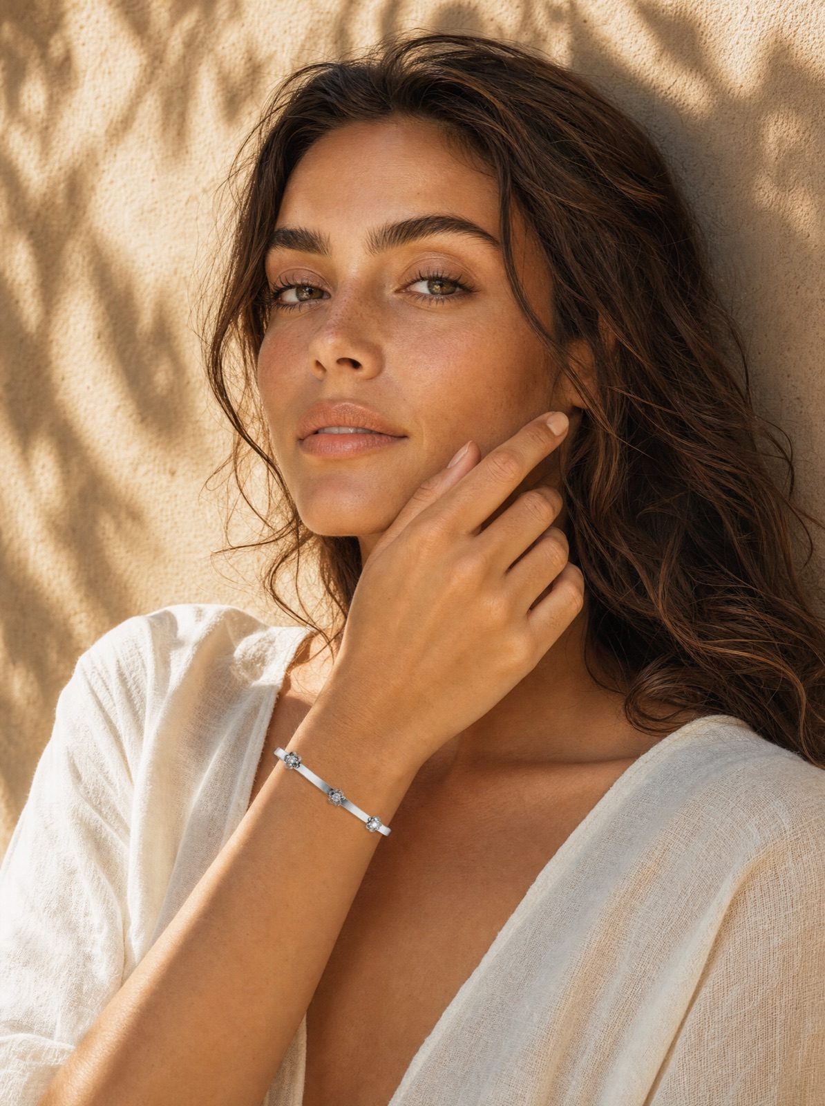 woman wearing the fiore bangle in silver, portrait in dappled afternoon light on an amalfi terrace
